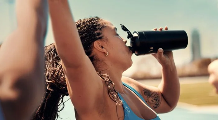 woman drinking protein shake